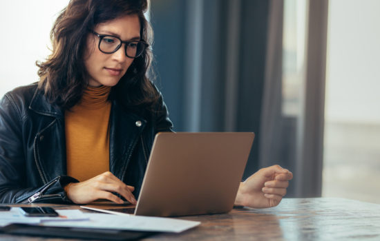 Asian woman working laptop. Business woman busy working on laptop computer at office.